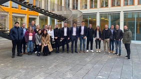 A group of people in front of a building